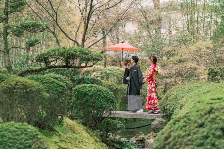two people in japanese dress in hakone garden